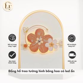 đồng hồ treo tường hoa độc đáo Đồng hồ treo tường hình bông hoa cam, nổi bật với đèn LED âm tinh tế.